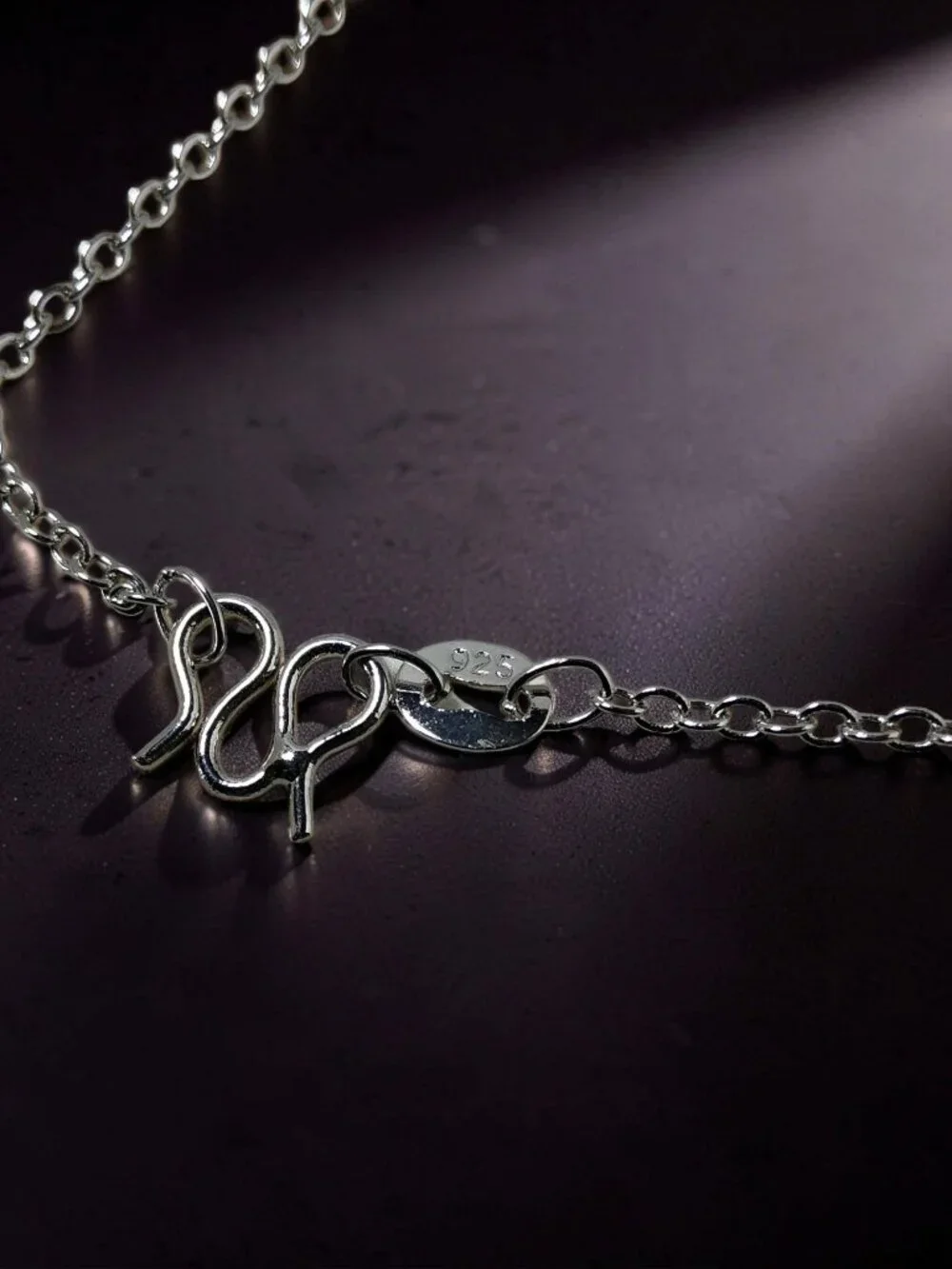 vintage Chrystal lined spiraled curled cross on a .925 sterling necklace